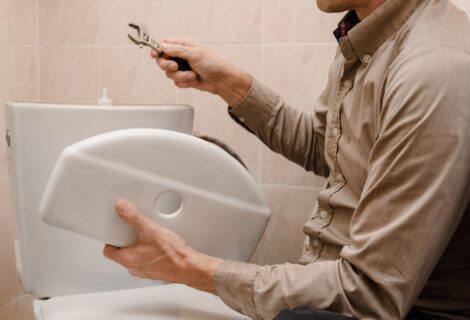 Plumber-repairing-toilet-1