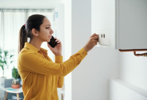 Woman-calling-a-Plumber-for-hot-water-issue